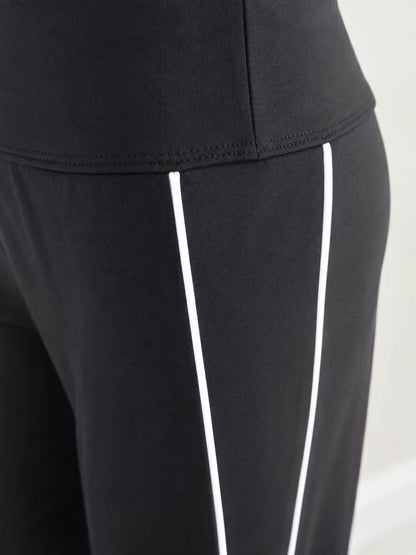 Pantalon AirFlow à jambe large – Noir à rayures blanches